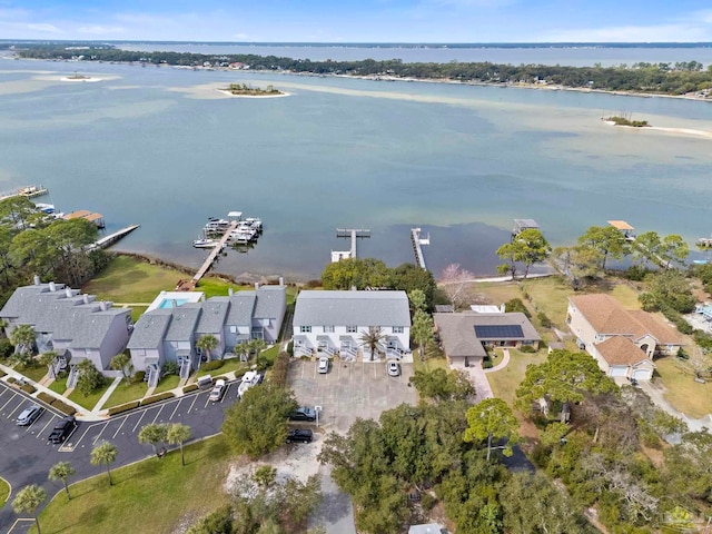 bird's eye view featuring a water view and a residential view