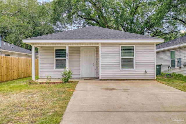 bungalow-style house with a front yard