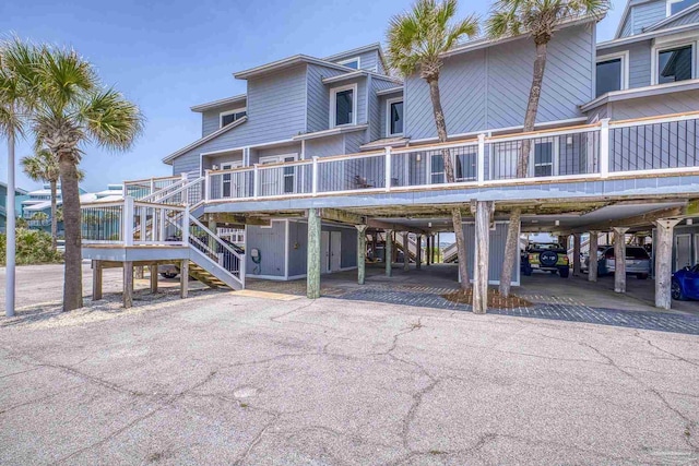 1350 Ft Pickens Rd Unit 11, Pensacola Beach, FL 32561 - view of front facade featuring stairway and covered parking