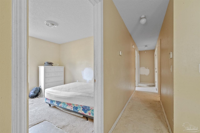 carpeted bedroom with a textured ceiling