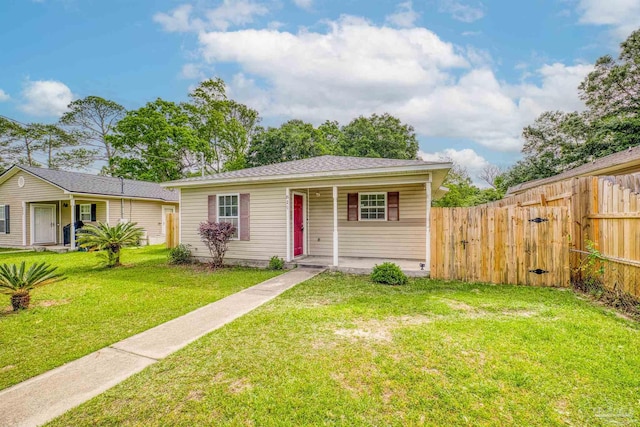 bungalow-style house featuring a front lawn