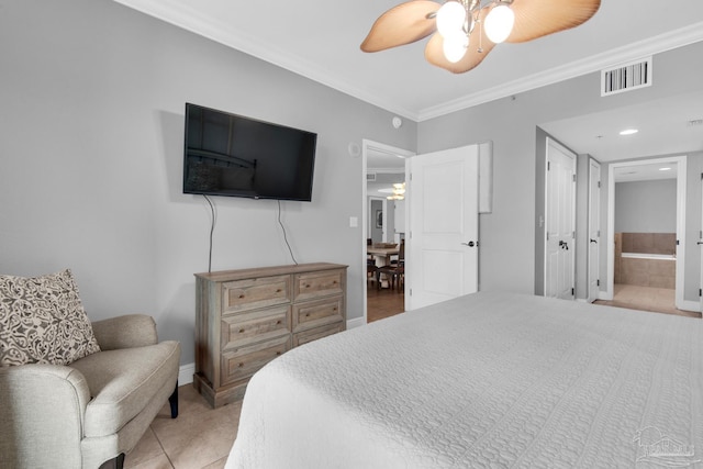 bedroom with light tile patterned floors, crown molding, ceiling fan, and ensuite bathroom