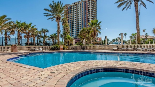 view of pool with a community hot tub