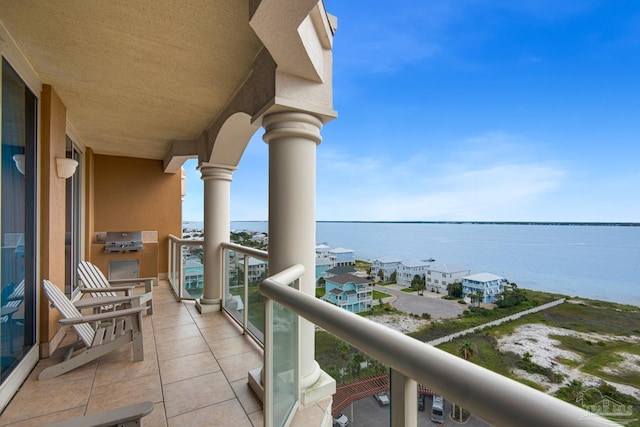 balcony featuring a water view