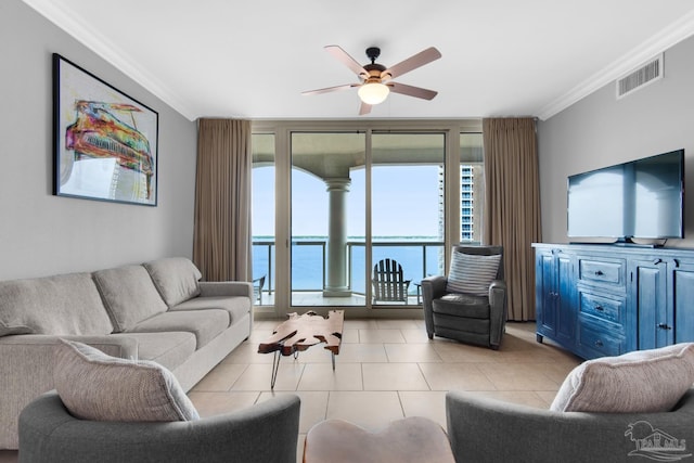 tiled living room featuring crown molding, plenty of natural light, ceiling fan, and a wall of windows