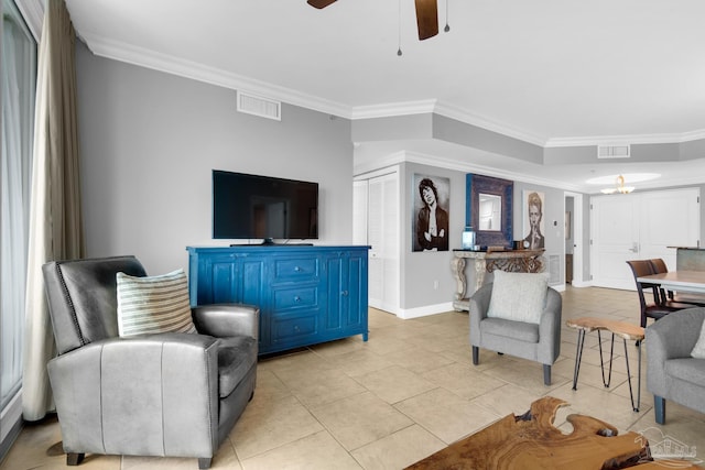 living room featuring crown molding, ceiling fan, and light tile patterned floors