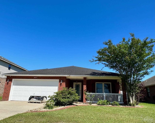 4955 Makenna Cir, Pace, FL 32571 - view of front facade with brick siding, a garage, covered porch, concrete driveway, and a front lawn