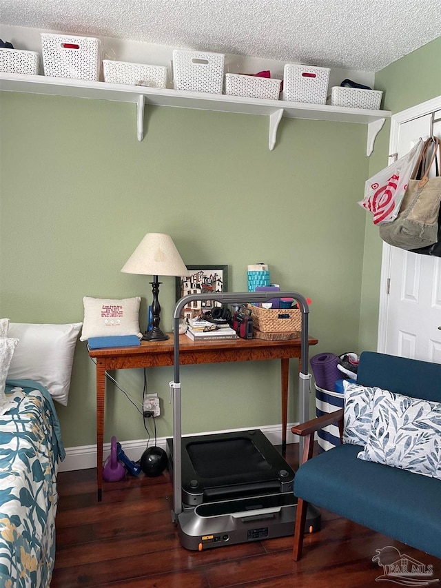 4955 Makenna Cir, Pace, FL 32571 - office featuring wood finished floors, baseboards, and a textured ceiling