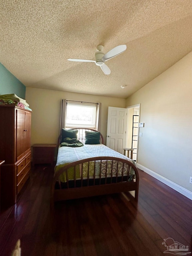 4955 Makenna Cir, Pace, FL 32571 - bedroom with a textured ceiling, wood finished floors, a ceiling fan, and baseboards