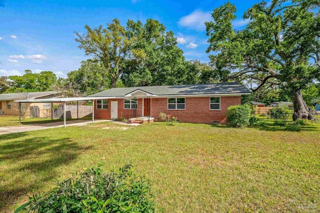 ranch-style home featuring fence, a carport, a front lawn, and brick siding