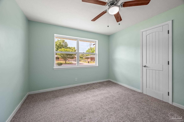 unfurnished bedroom with baseboards, ceiling fan, and carpet flooring