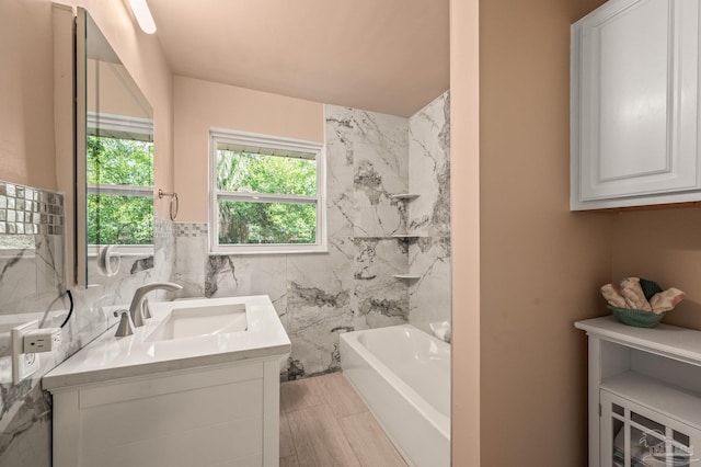 bathroom with tile walls and vanity