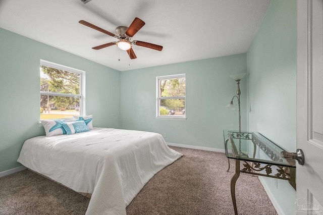 bedroom with baseboards, carpet, and ceiling fan