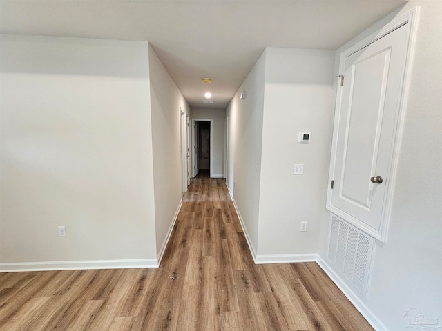 hallway featuring light hardwood / wood-style flooring