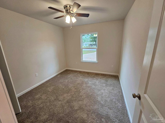 spare room featuring carpet floors and ceiling fan