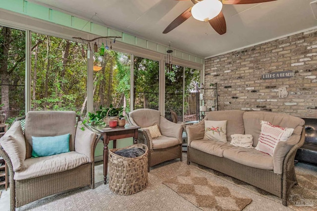 sunroom / solarium featuring ceiling fan