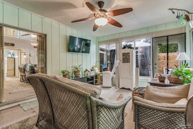 sunroom / solarium with ceiling fan