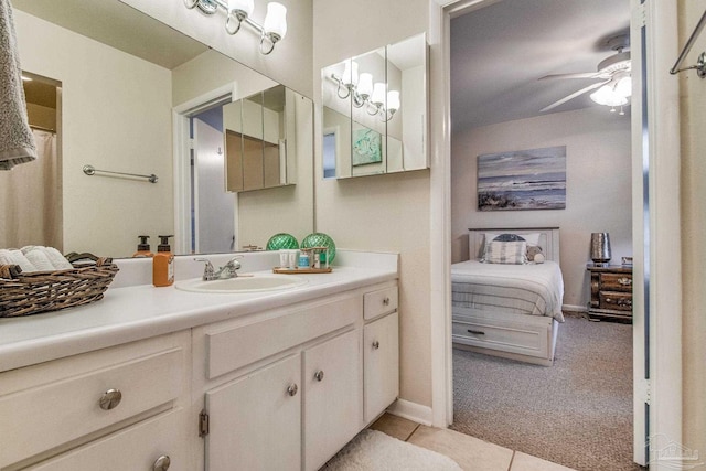 bathroom with ceiling fan, vanity, and tile patterned flooring