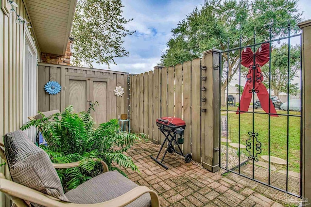 view of patio / terrace with a playground and a grill