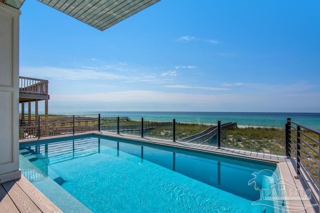 view of swimming pool featuring a water view