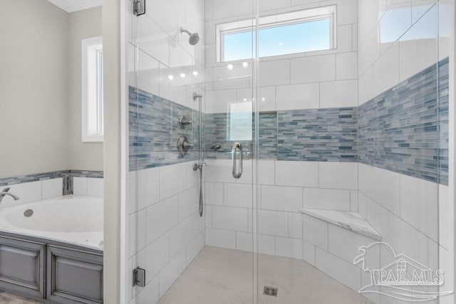 bathroom with shower with separate bathtub