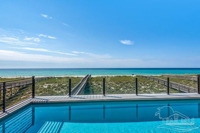 view of pool with a water view