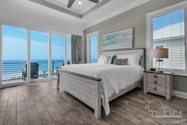 bedroom with ceiling fan, dark hardwood / wood-style flooring, a water view, ornamental molding, and access to outside