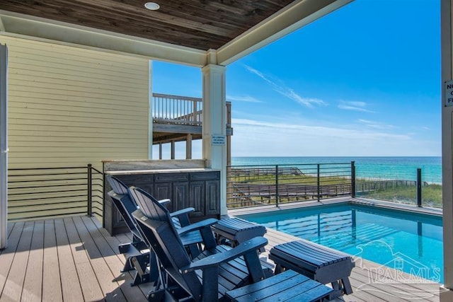 view of pool featuring a water view