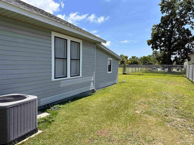 view of yard featuring central air condition unit