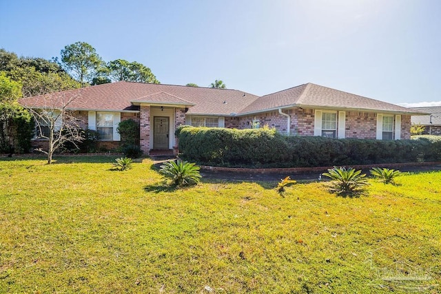 single story home with a front yard