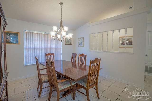 dining room with lofted ceiling, a chandelier, and light tile patterned floors