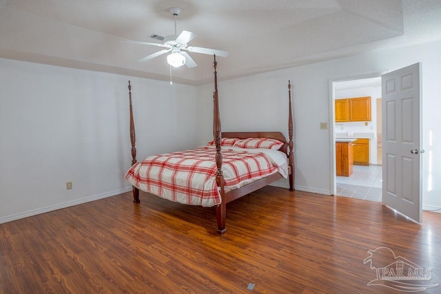 bedroom with ceiling fan and hardwood / wood-style flooring