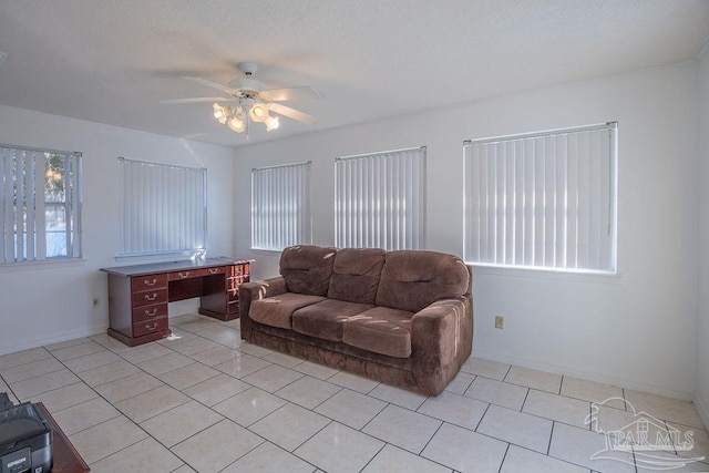 living room with light tile patterned floors and ceiling fan