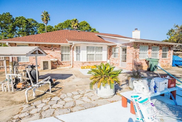 rear view of house featuring a patio