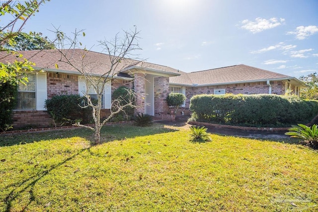 ranch-style home with a front yard