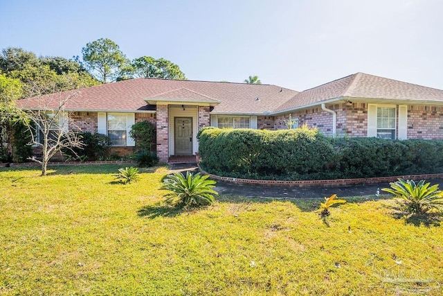 ranch-style house with a front lawn