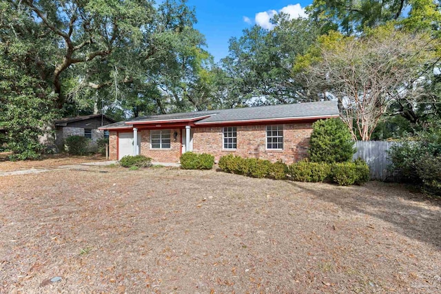 ranch-style home featuring a garage