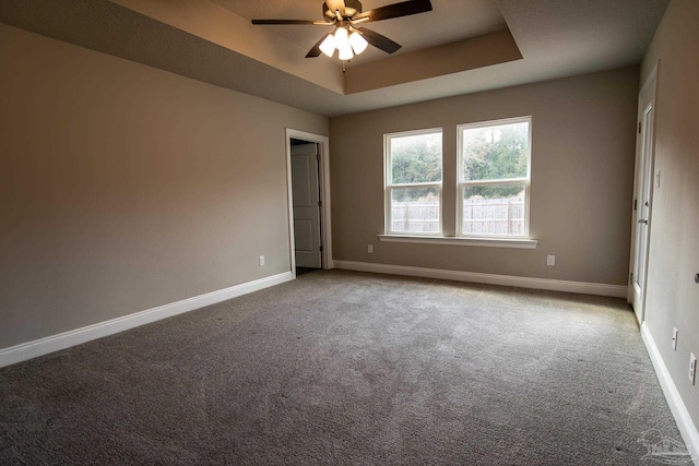 4483 Watkins St, Pace, FL 32571 - unfurnished room featuring a ceiling fan, a raised ceiling, carpet floors, and baseboards