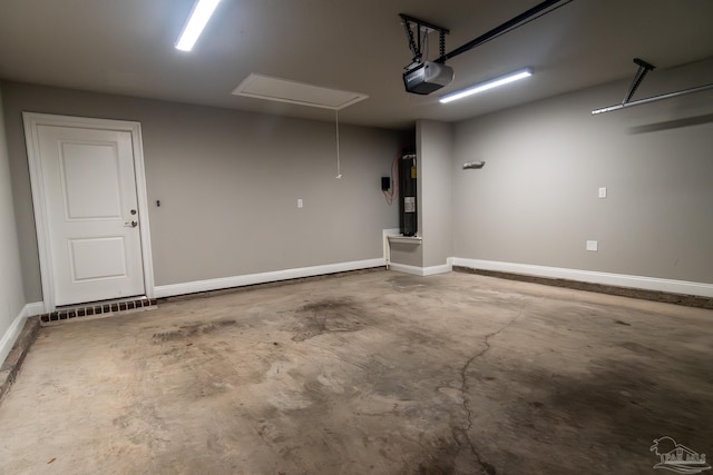 4483 Watkins St, Pace, FL 32571 - garage with a garage door opener, water heater, and baseboards