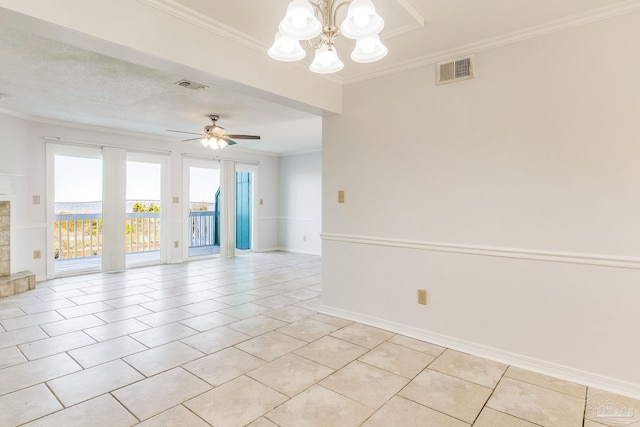 empty room featuring a fireplace, ceiling fan with notable chandelier, crown molding, and light tile patterned flooring