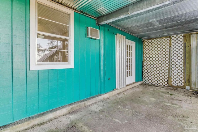 view of property exterior with a wall mounted air conditioner