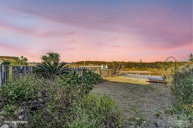 view of yard at dusk