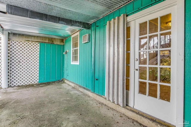 view of patio with an AC wall unit