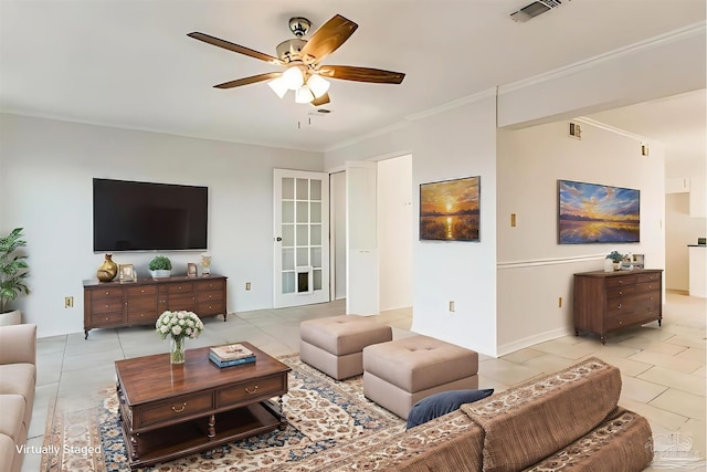 living room featuring ceiling fan, light tile patterned floors, and crown molding