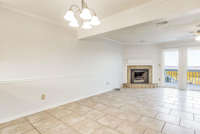 unfurnished living room with crown molding, a textured ceiling, a fireplace, light tile patterned floors, and ceiling fan with notable chandelier