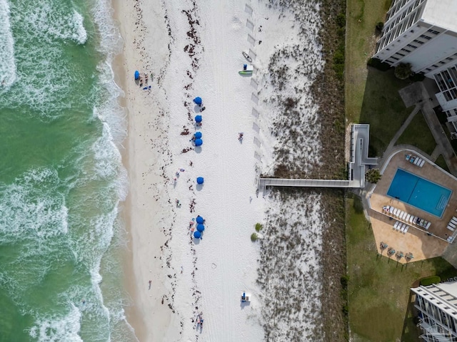 bird's eye view featuring a beach view and a water view
