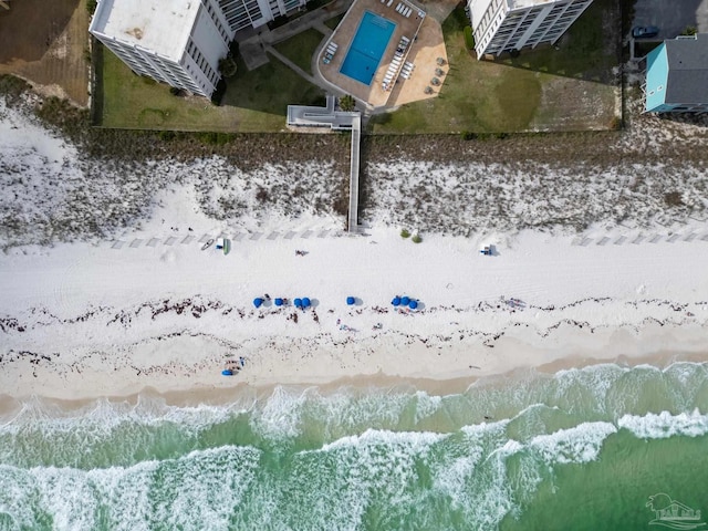 aerial view with a water view and a beach view