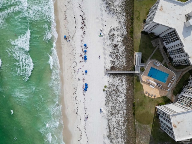drone / aerial view with a beach view and a water view