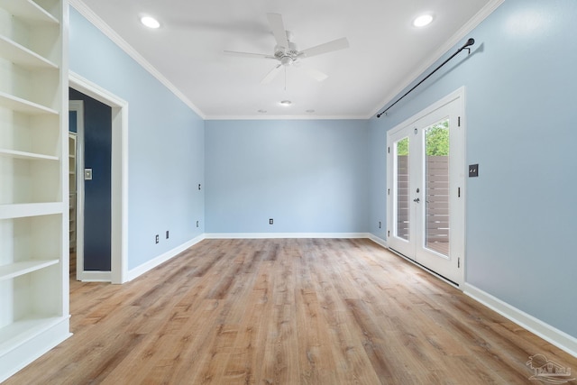 unfurnished room featuring crown molding, baseboards, light wood finished floors, a ceiling fan, and built in features