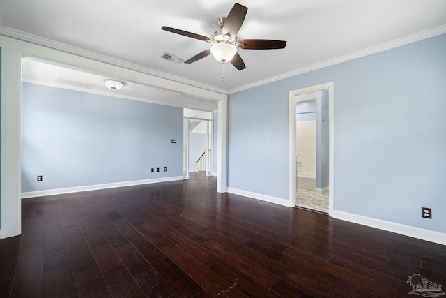 spare room featuring visible vents, wood finished floors, a ceiling fan, and crown molding